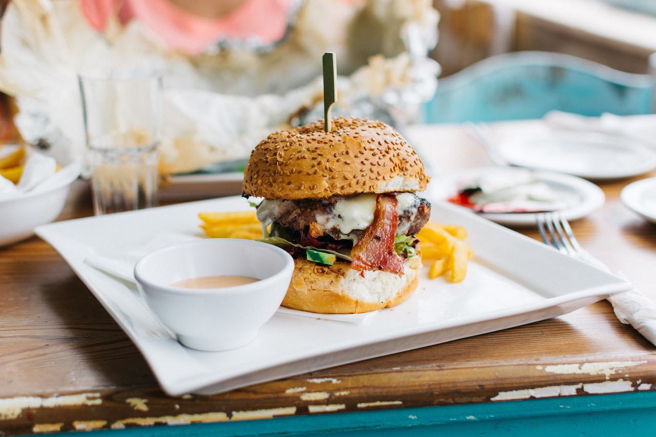 Juicy Burger in a Vibrant Interior